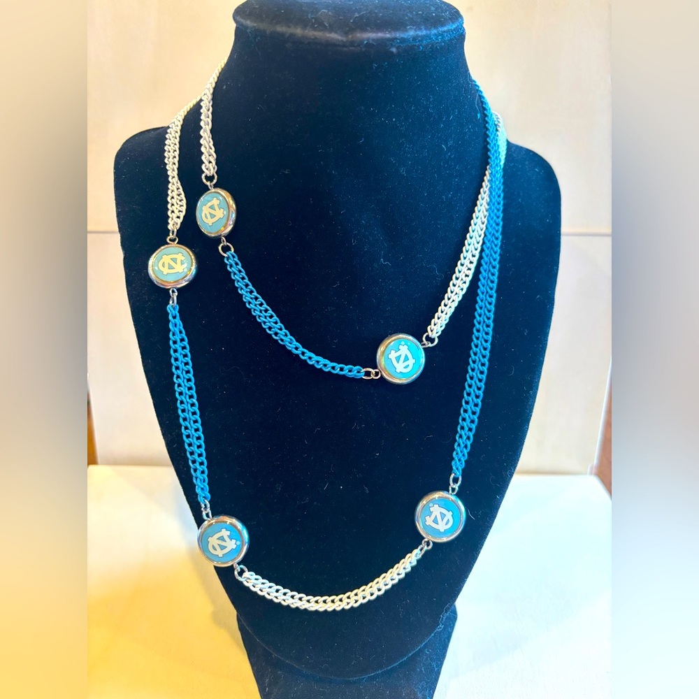 Plays accessory necklace. North Carolina Tar Heels. Blue and White chain. 38”